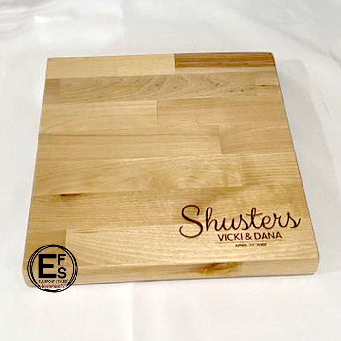 Personalized cutting board engraved with family name and couple names for wedding gift